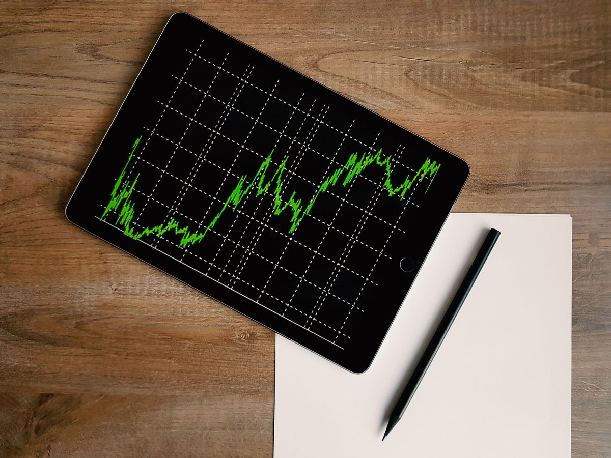 A rising chart on a tablet