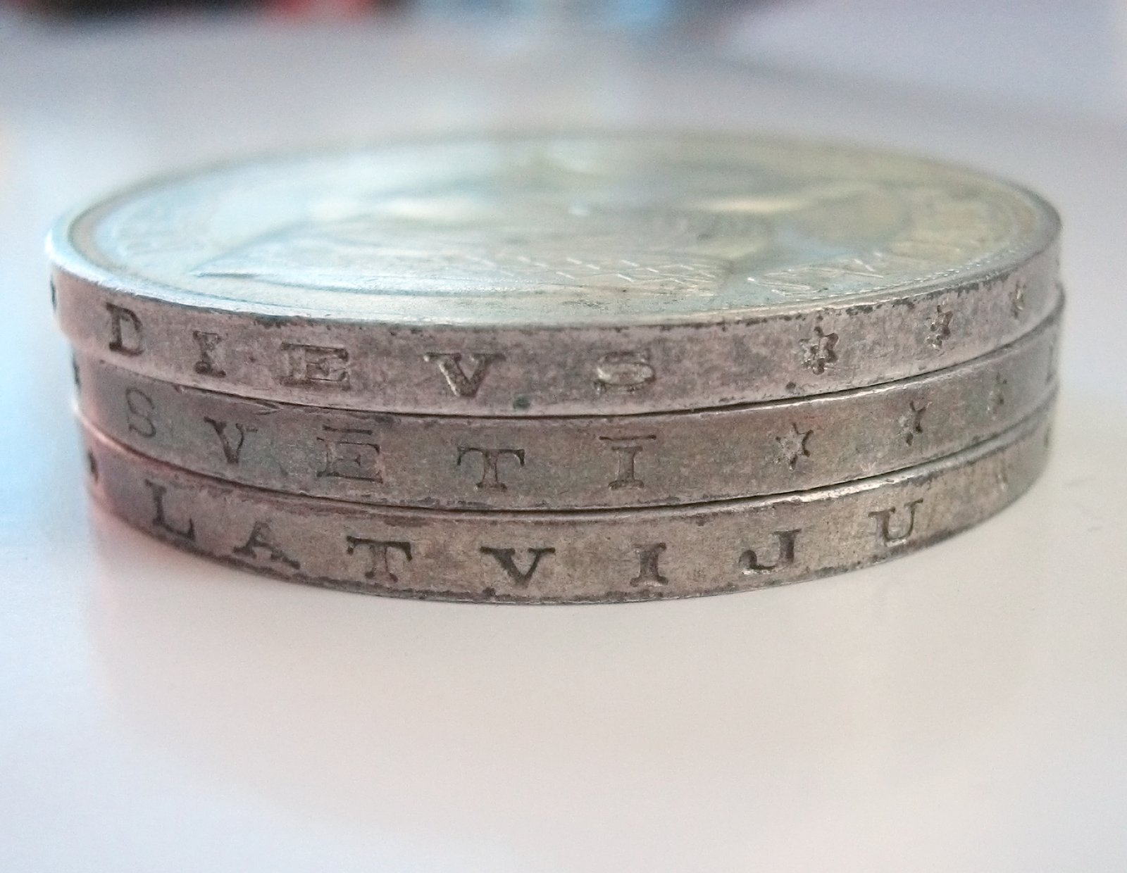 Lettered edge of silver coins