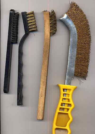 Brushes for cleaning coins