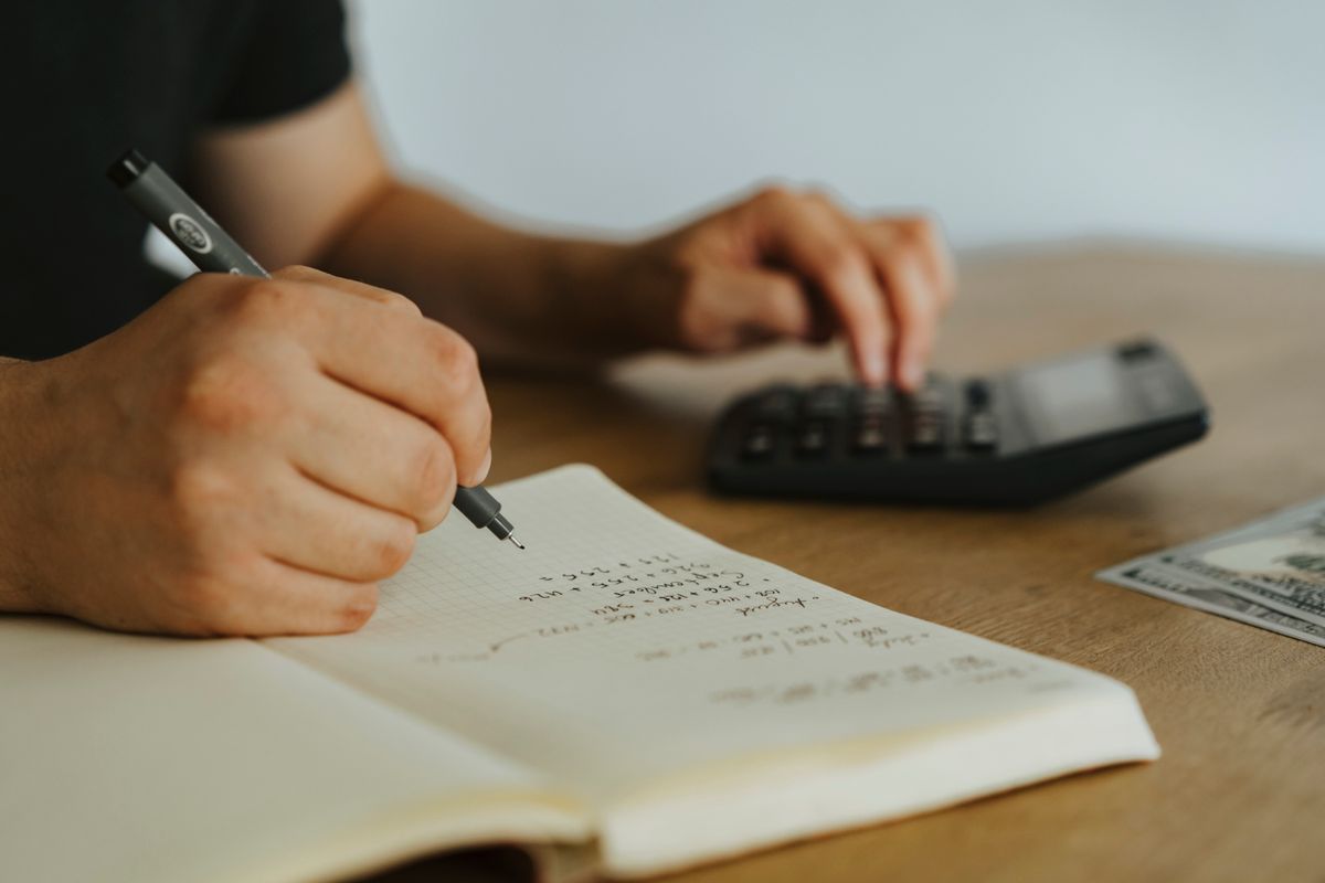 Working out figures on paper with a calculator