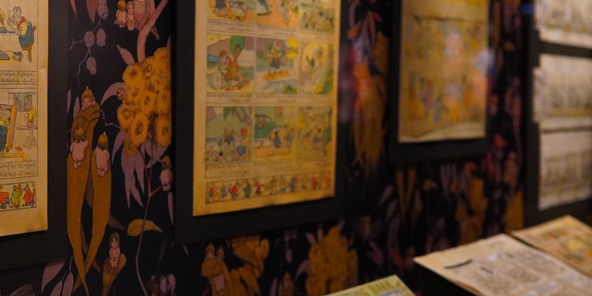 Old comics displayed on a wall and table