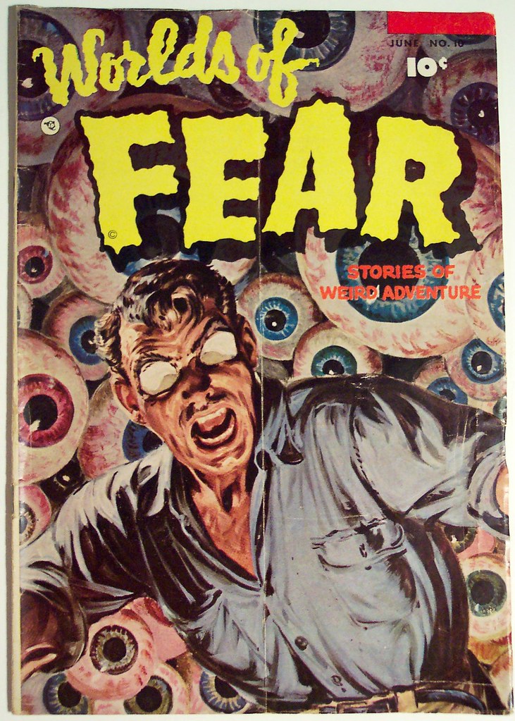 Worn cover of an old comic with a crease