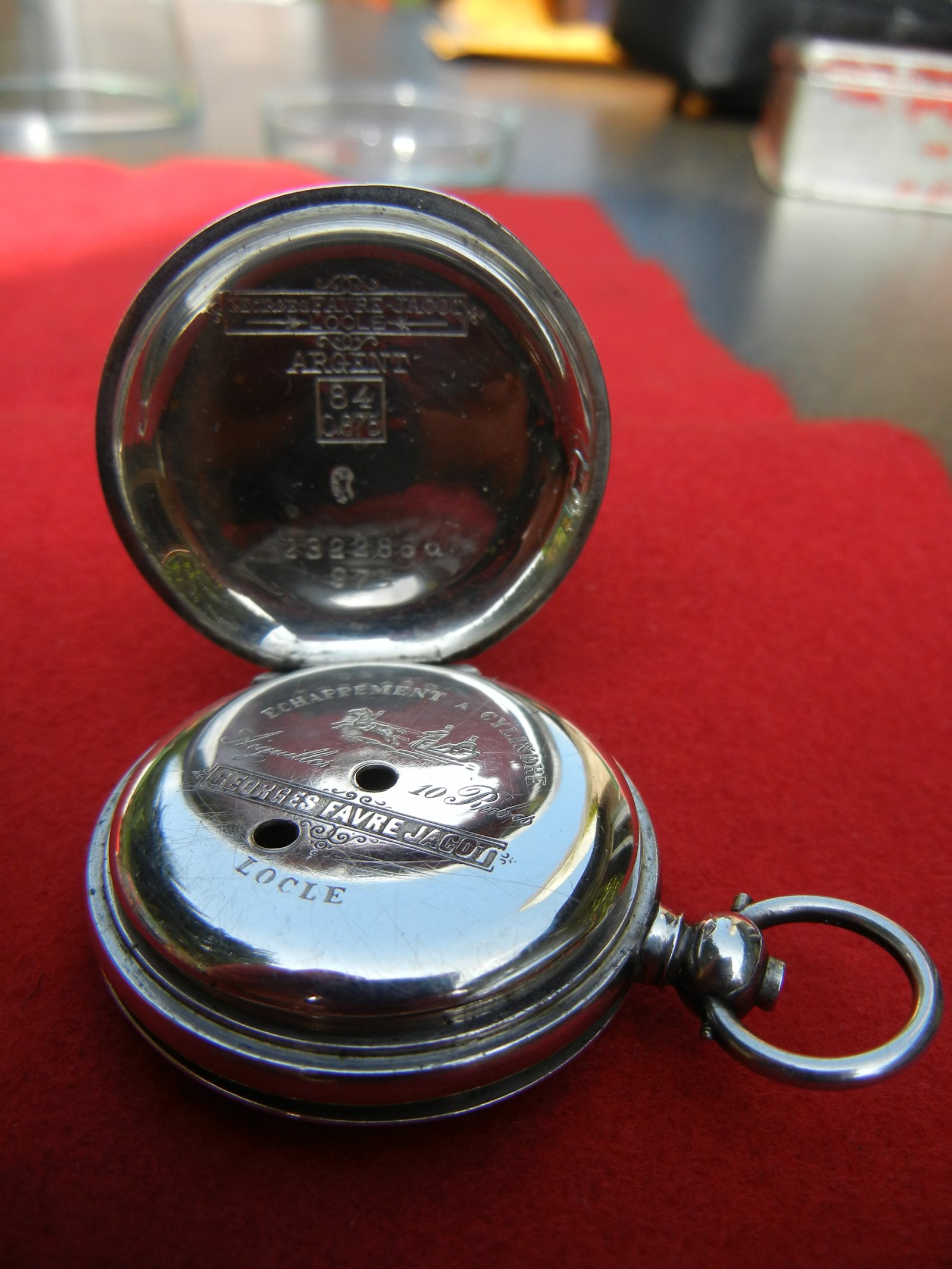 Inside of a pocket watch case back with hallmarks